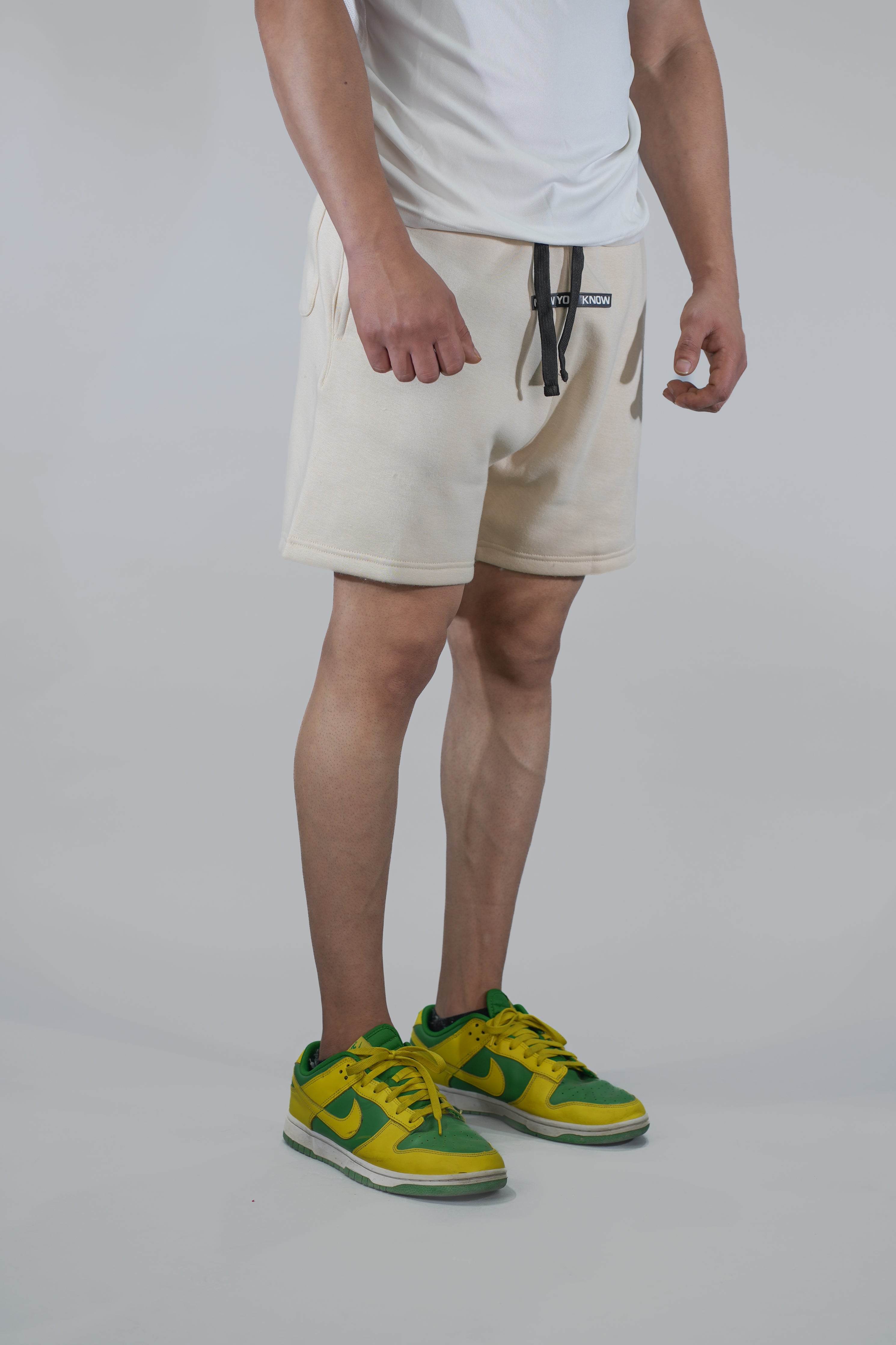 Cream Solid Relaxed Fit Shorts