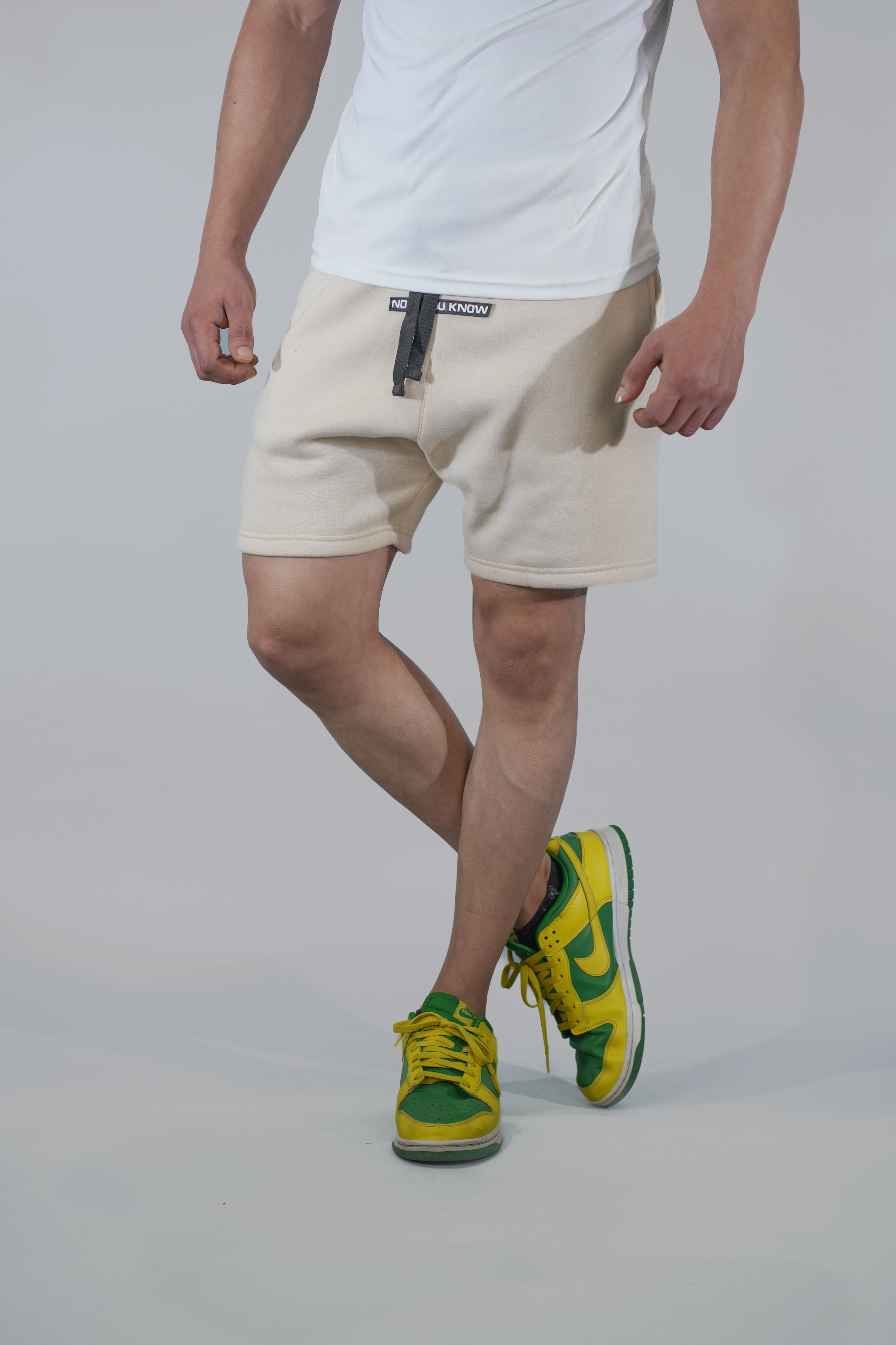 Cream Solid Relaxed Fit Shorts
